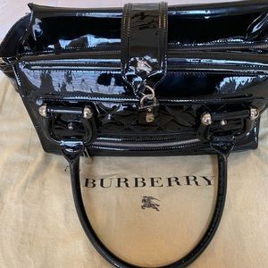 Burberry Black patent leather shoulder bag.